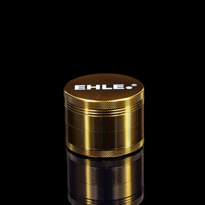 Grinder EHLE in alluminio 63mm Oro – 4 pezzi con setaccio per polline